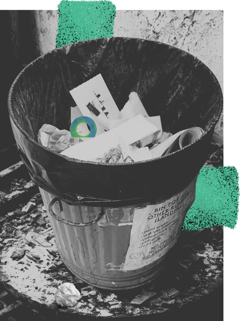 Outdoor rubbish bin with paper waste and green graphic accents.